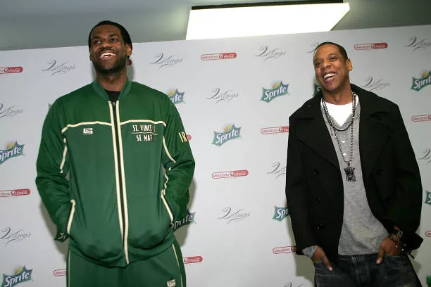 Superstar LeBron James and producer/rapper Shawn "Jay-Z" Carter speak to reporters before meeting with kids at the Dallas Boys & Girls Club on...